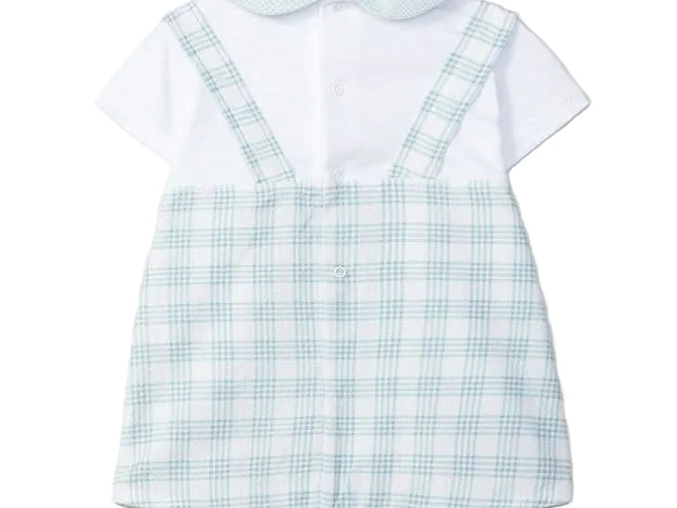 Children's outfit with white shirt and blue checkered overalls on a light gray background