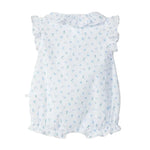 White baby dress with blue floral pattern on a light gray background