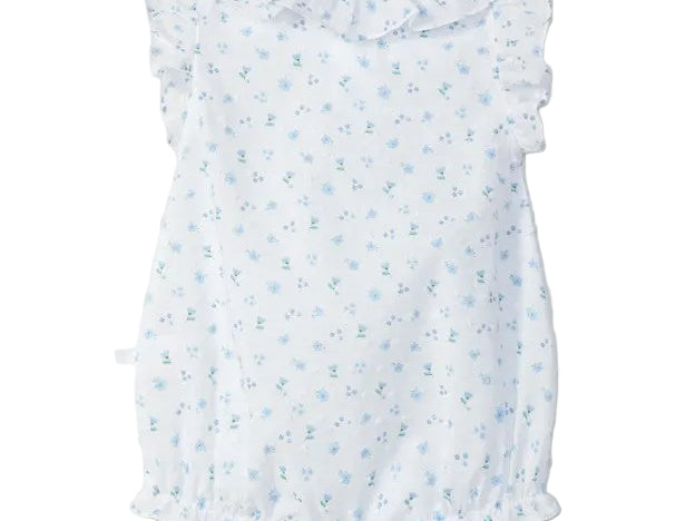 White baby dress with blue floral pattern on a light gray background