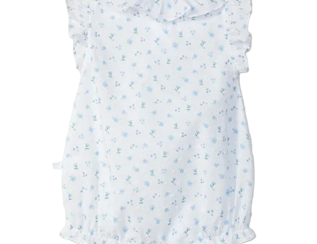 White baby dress with blue floral pattern on a light gray background