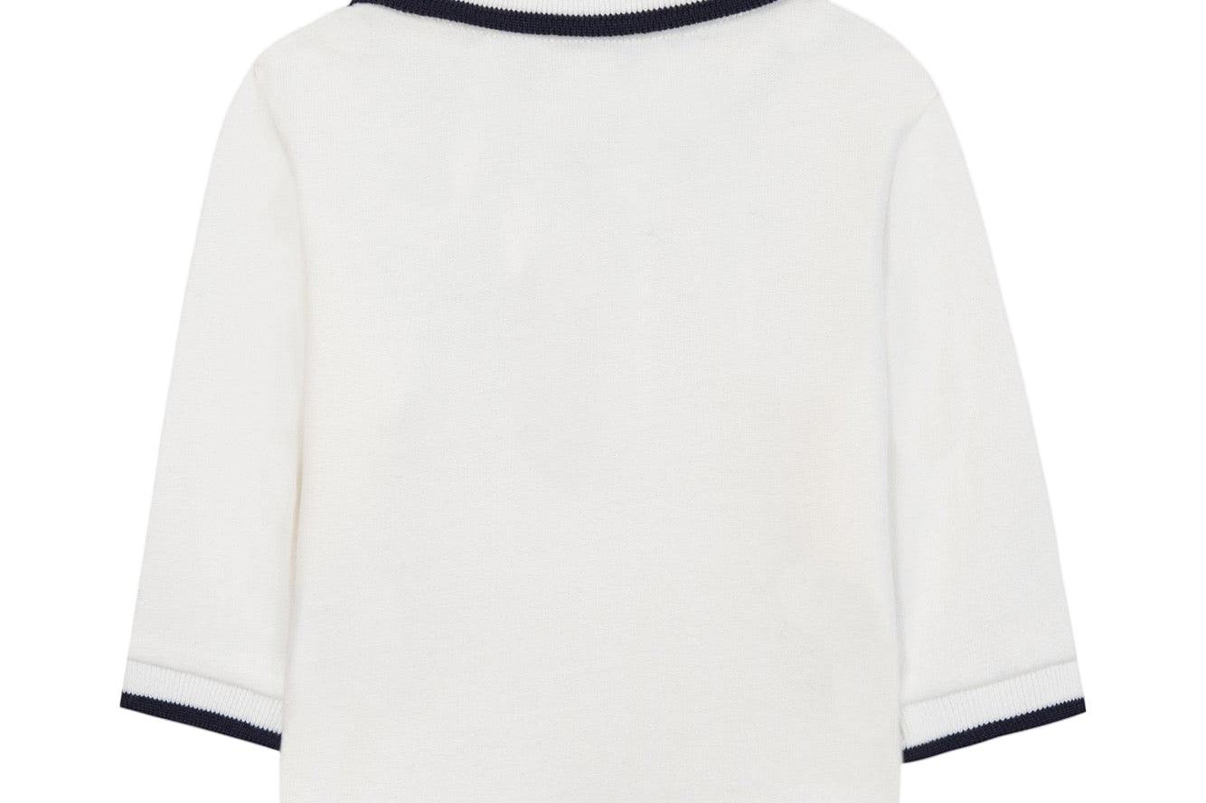 White sweater with black trim on a white background