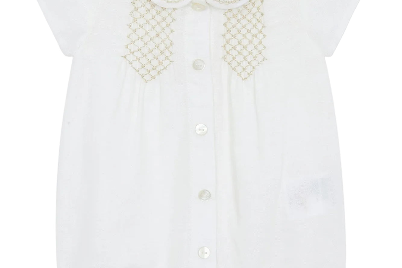 White blouse with lace details on a white background