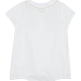 White sleeveless top on a light beige background