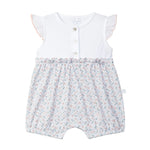 Baby romper with floral pattern on a light gray background