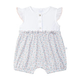 Baby romper with floral pattern on a light gray background