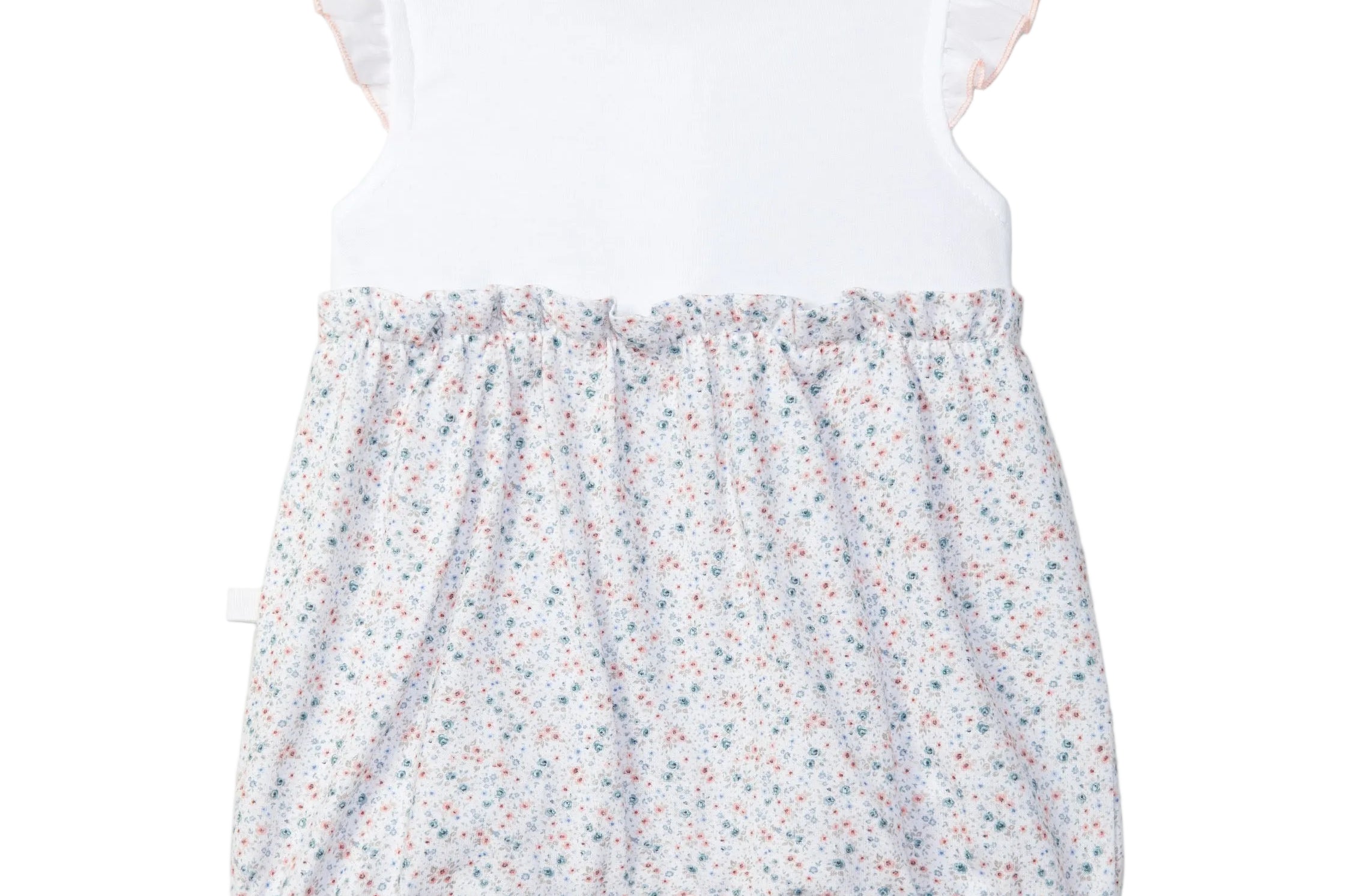 Baby romper with floral shorts and white top on a light gray background