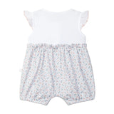 Baby romper with floral shorts and white top on a light gray background
